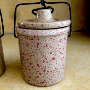 Pair of vintage mini cheese crocks with lids and wire bails.
